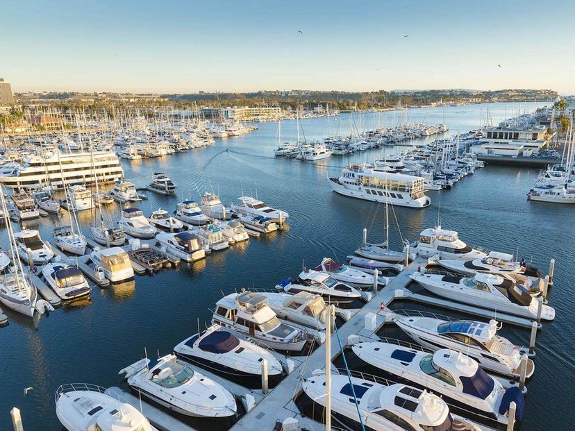 Yacht club in Marina Del Rey with large yachts lined up in a marina. Yacht club in Marina Del Rey with large yachts lined up in a marina.