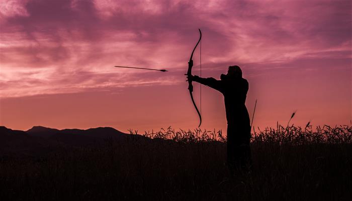 aiming at a target with a bow and arrow. aiming at a target with a bow and arrow.