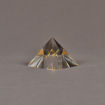 Angle View of 3" x 3" pyramid acrylic embedment award with brass model of airplane cast inside.