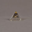 Front view of 3" x 3" pyramid acrylic embedment award with brass model of airplane cast inside.