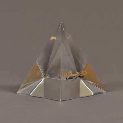 Angle view of 5" x 6" pyramid acrylic embedment award with Highland Little Theatre text cast inside.