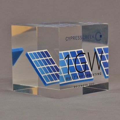 Angle view of 4" cube acrylic embedment award with mock solar panel cast into crystal clear acrylic.