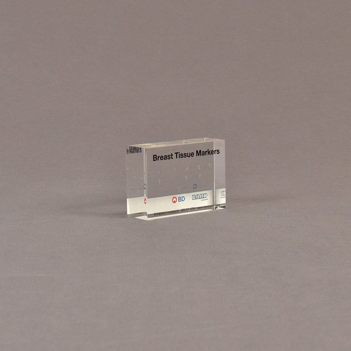 Angle view of 2" x 3" rectangle acrylic embedment award with medical tissue markers cast in acrylic.