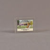 Front view of 3" x 4" rectangle acrylic embedment award with mini ground breaking shovel and building cast in acrylic.