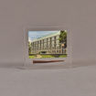 Front view of 4" x 4 1/2" rectangle acrylic embedment award with rusty nail and building photo cast into acrylic.