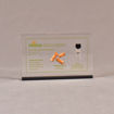 Front view of 4" x 6" rectangle acrylic embedment award with wood pellets and oil vial cast into clear acrylic.