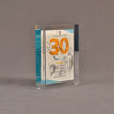 Angle view of 5 1/2" x 6" rectangle acrylic embedment award with Sports Spectacular Top 30 Honorees cast in acrylic.