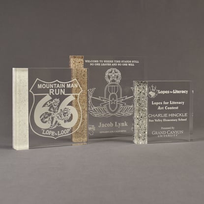 Three Composites™ Square Acrylic Awards grouped showing Staron® Sanded White Pepper, Aspen Brown and Platinum Grey accent options.