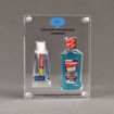 Front view of x-large Allure™ Acrylic Encasement Award with Colgate toothpaste and mouthwash bottle encased into clear acrylic showing full color imprint.