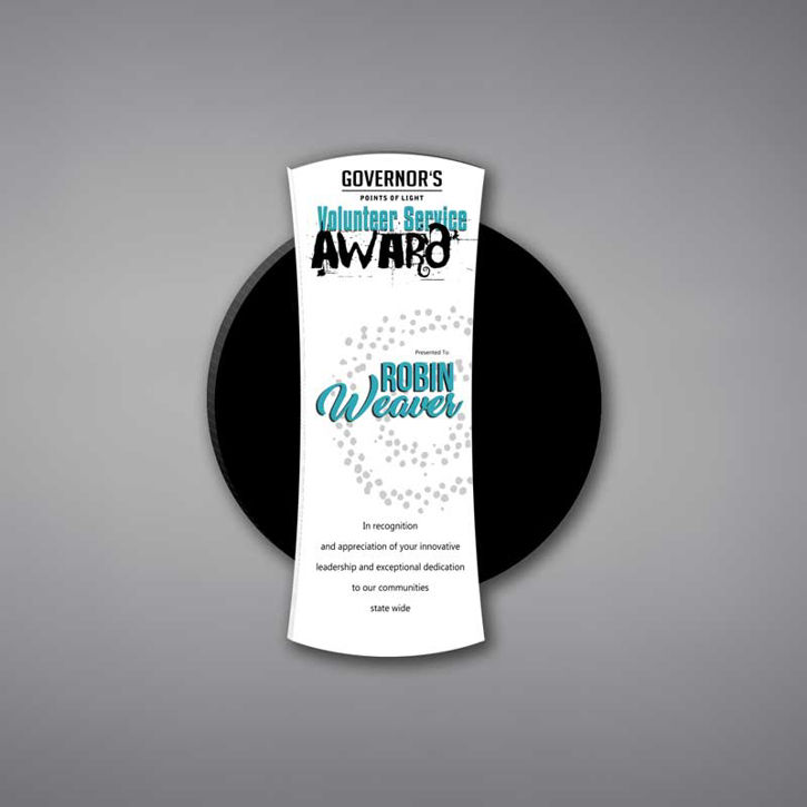 Eclipse Acrylic Plaque shown 11" tall with a white acrylic face plate eclipsing a black acrylic circle with Volunteer Service Award printed.