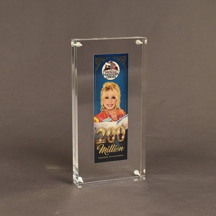 Angle view of an acrylic encased commemorative bookmark designed and created for the Dolly Parton Imagination Library.