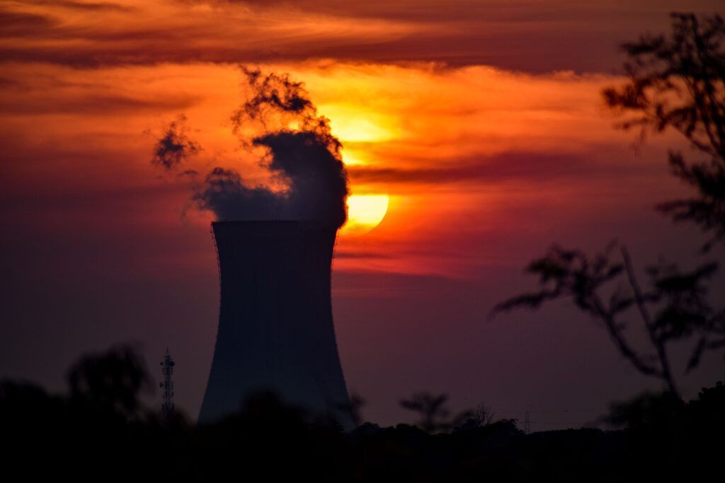 Cooling tower silhouette at sunset.