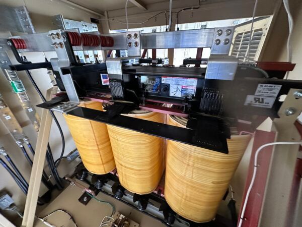Close-up of industrial electrical transformer components.