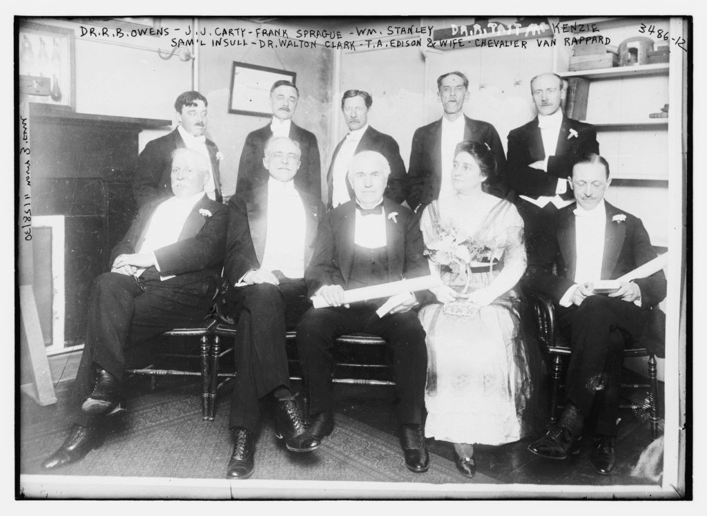 Group of distinguished people in formal attire, early 1900s.
