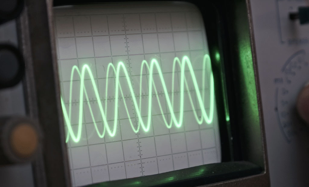 Oscilloscope displaying green waveform on screen
