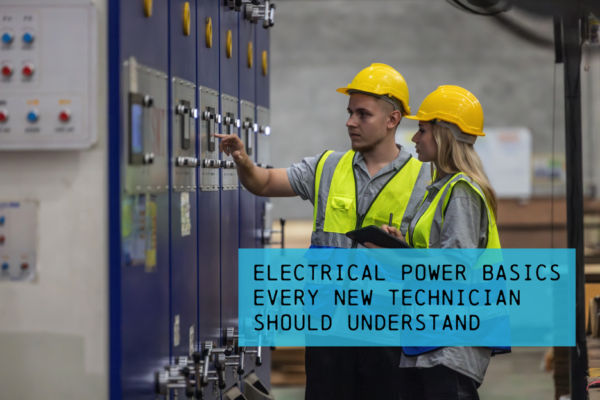 Technicians inspecting industrial electrical control panels