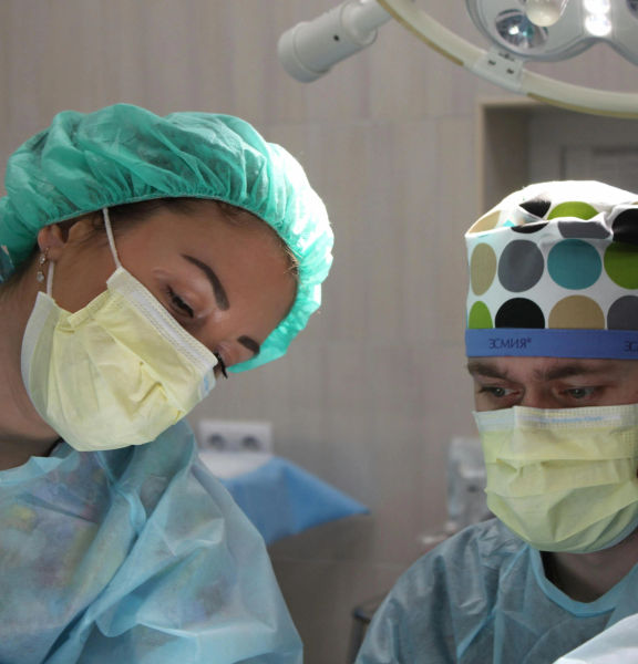 Two surgeons in an operating theatre.