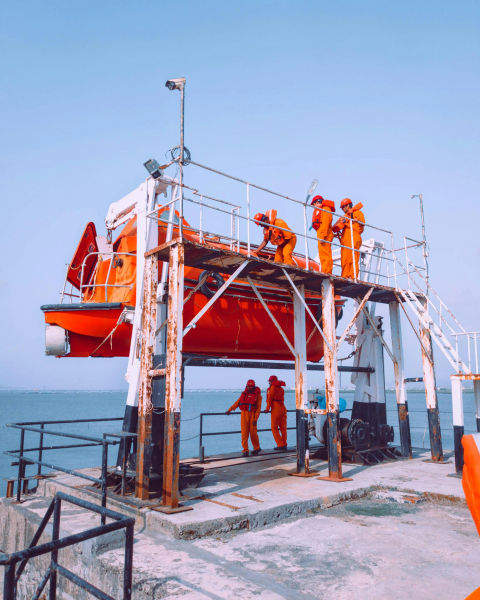 A shot of workers inspecting a support craft.