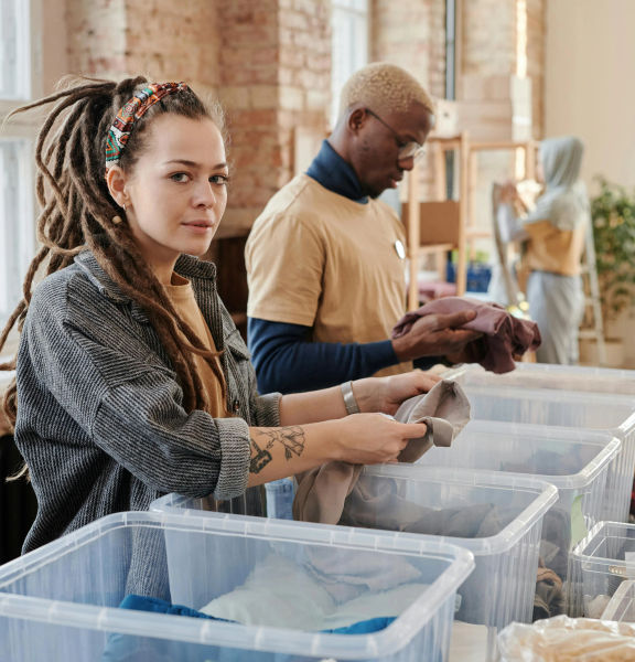 Two people working in a community space.