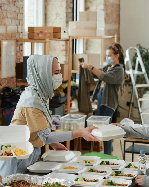 Three people working in a community environment.