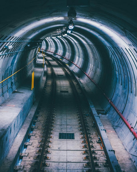 A shot of a subway tunnel curving into the distance.