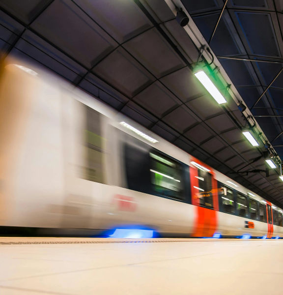 A train passing quickly through a terminal.