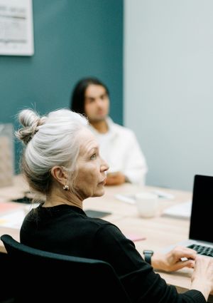 Several people in an office environment.