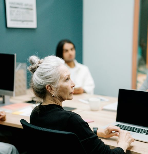 Several people in an office environment.