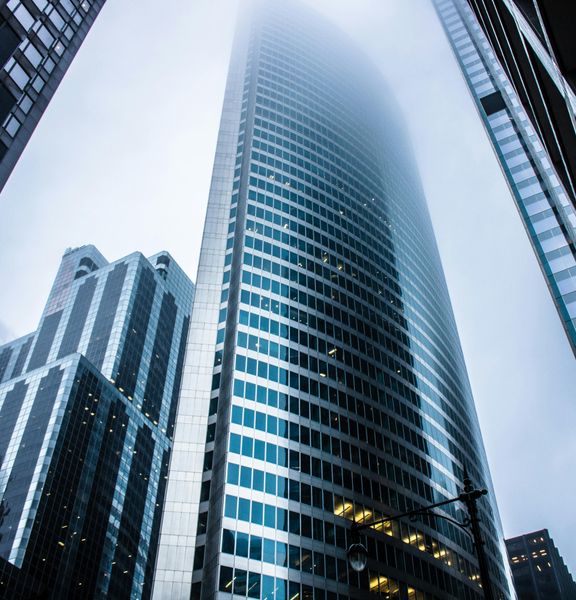 A shot of a city looking upward from street level.
