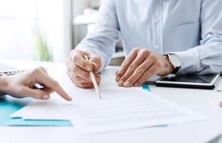 Two people reviewing a document.