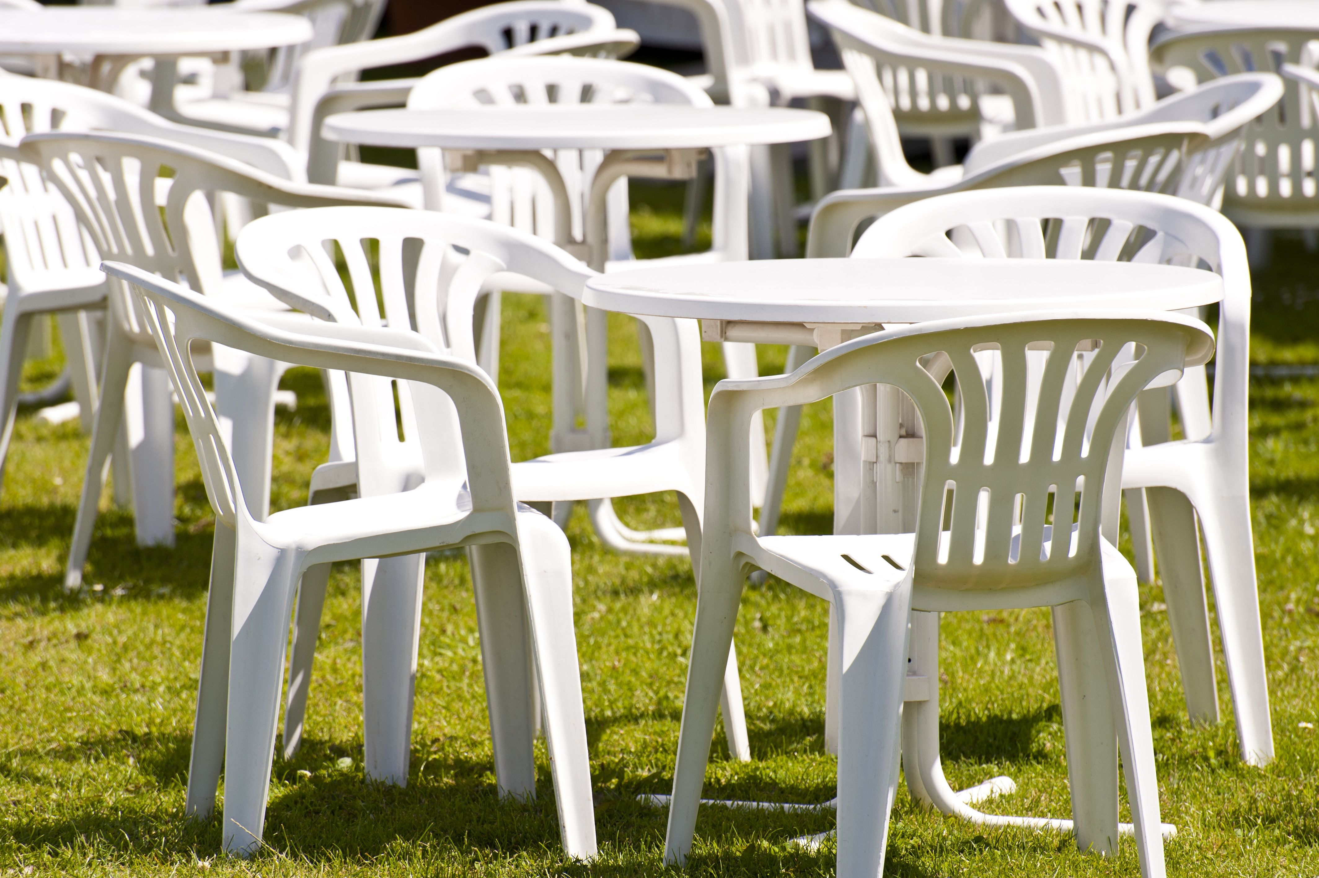 Outdoor furniture white on green grass