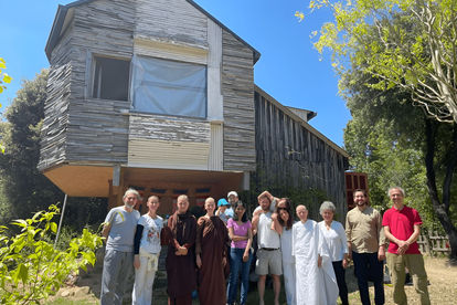 Inauguration celebrants standing in front of Sarana's main building.