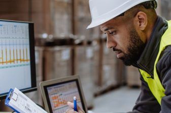 An image of a Warehouse Administrative Assistant at Anglo Pacific, in the Anglo Pacific storage warehouse.