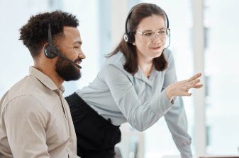 A Baggage Manager at Anglo Pacific helping a team member in the office