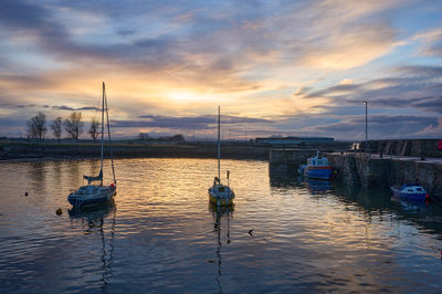 Port Seton at Night. Serene landscape with scattered boats on a picturesque body of water.