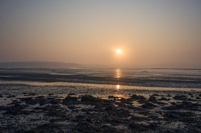 Serene sunset over tidal flats at Cramond Island