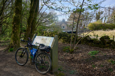 A bicycle rests at Loch Leven trail, Scotland.