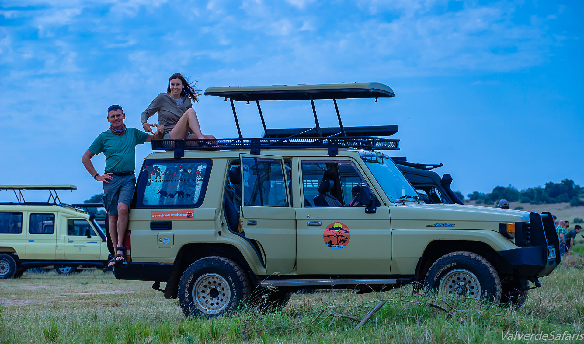 Valverde Safaris clients enjoying a guided wildlife tour from a custom 4x4 vehicle in Uganda