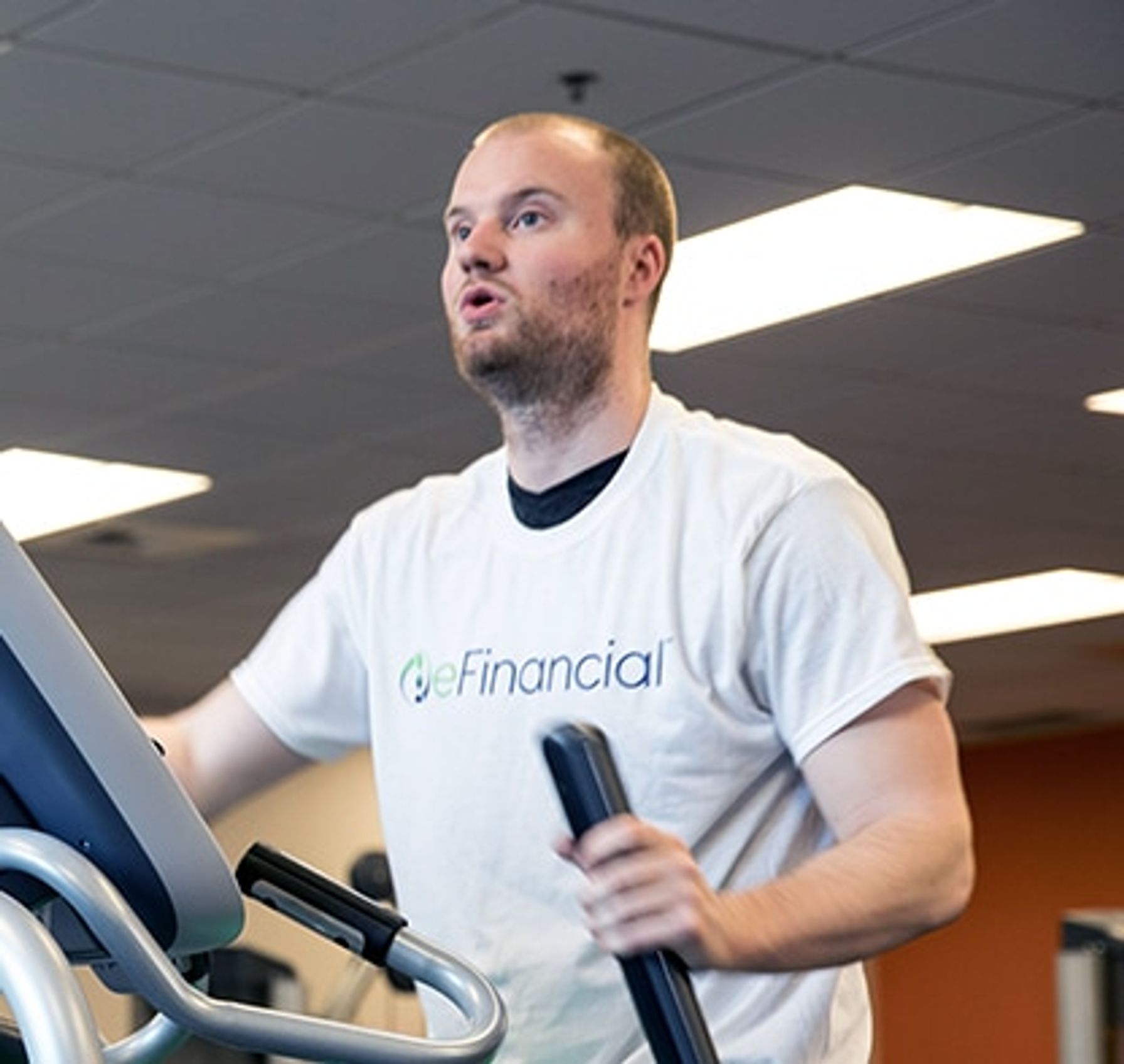 A man exercising on an elliptical