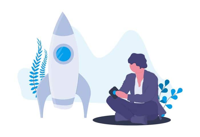 Digital Projects - man sitting down next to a rocket