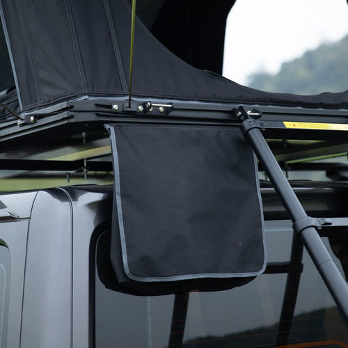 Durable rooftop tent attachment featuring a sturdy black fabric cover