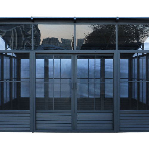 Stylish gray outdoor sunroom with glass panels and wooden detailing