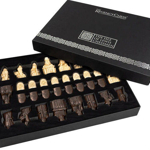 Isle of Lewis chessmen set featuring intricately designed dark and light pieces in a luxurious box