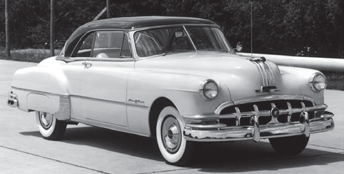 A 1950 Pontiac carries the Indian head hood ornament that stands out among vintage automotive trim pieces…