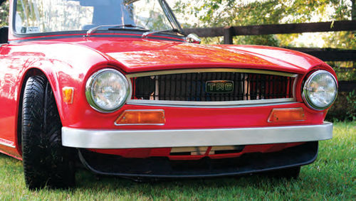 Photo 21. The handmade aluminum grille surround with the “floating” TR6 enamel emblem.