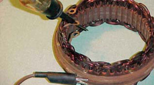 Photo 11. Testing the stator for grounds; perform on all windings.