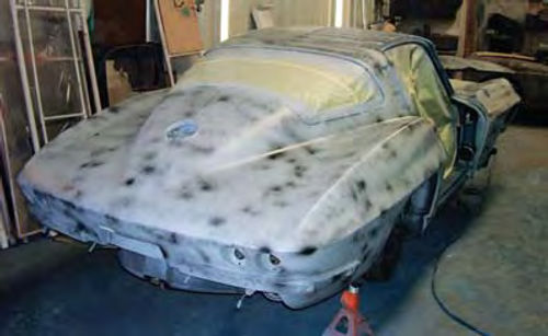 Photo 6. The test car after being sprayed with four coats of urethane primer using the DeVilbiss Tekna spray gun.