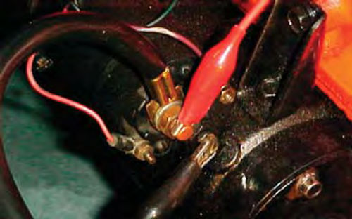 Photo 6. Proper voltmeter lead connections to test this GM solenoid for resistance.