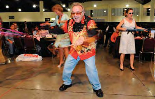 Barris took a turn with a hula hoop at the same auction event, and from the looks of things wasn’t doing bad at all…especially when you consider that he’s an octogenarian.