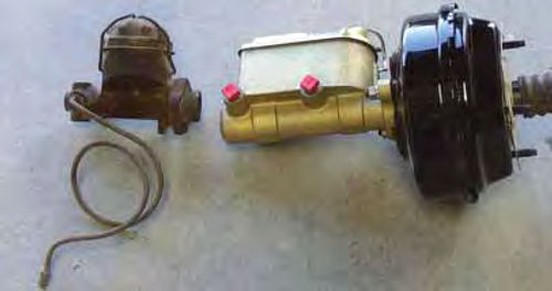 Photo 2. The old single-bowl master cylinder compared to the new two-bowl master cylinder. Notice the size difference. Capacity and safety are the issues here.